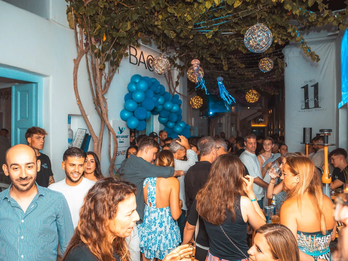 Guests filling the terrace at BAO'S under the balloon arch