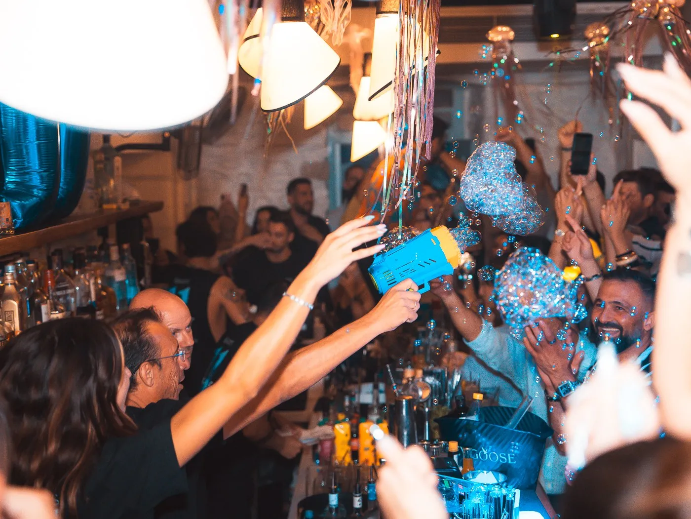 Bottle service arriving through the crowd at BAO'S, sparklers lit